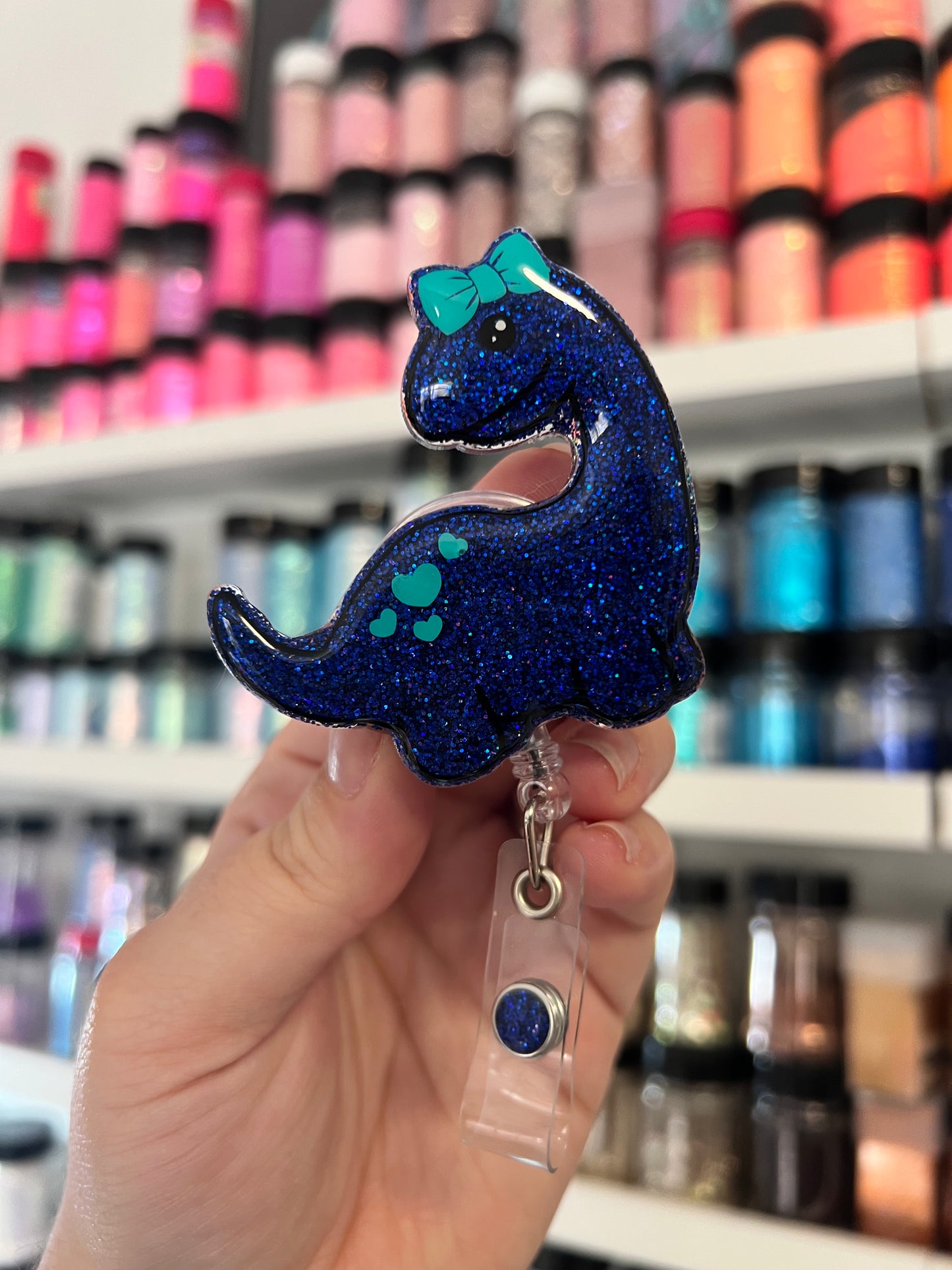 Dino with Bow Badge Reel
