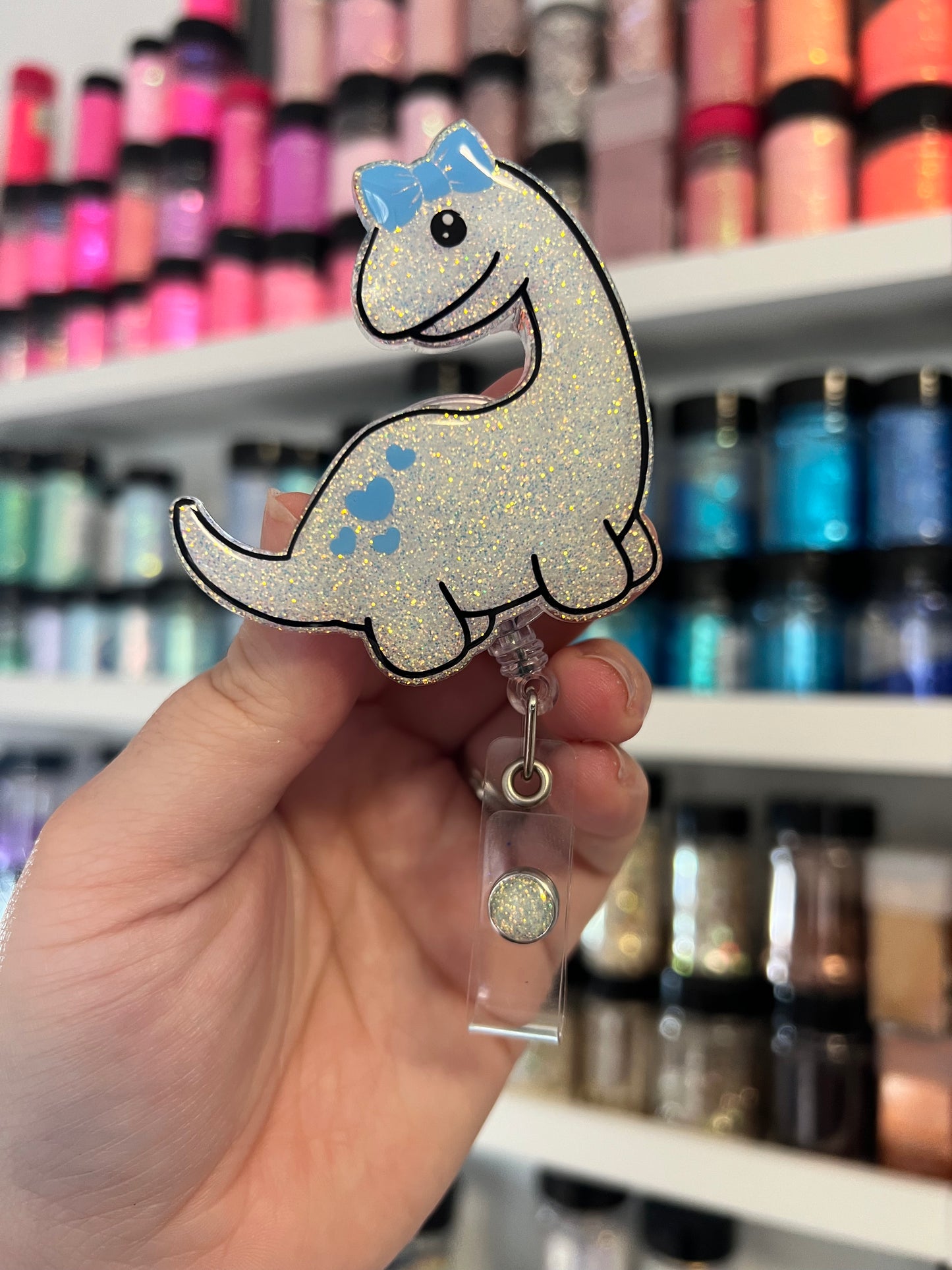 Dino with Bow Badge Reel
