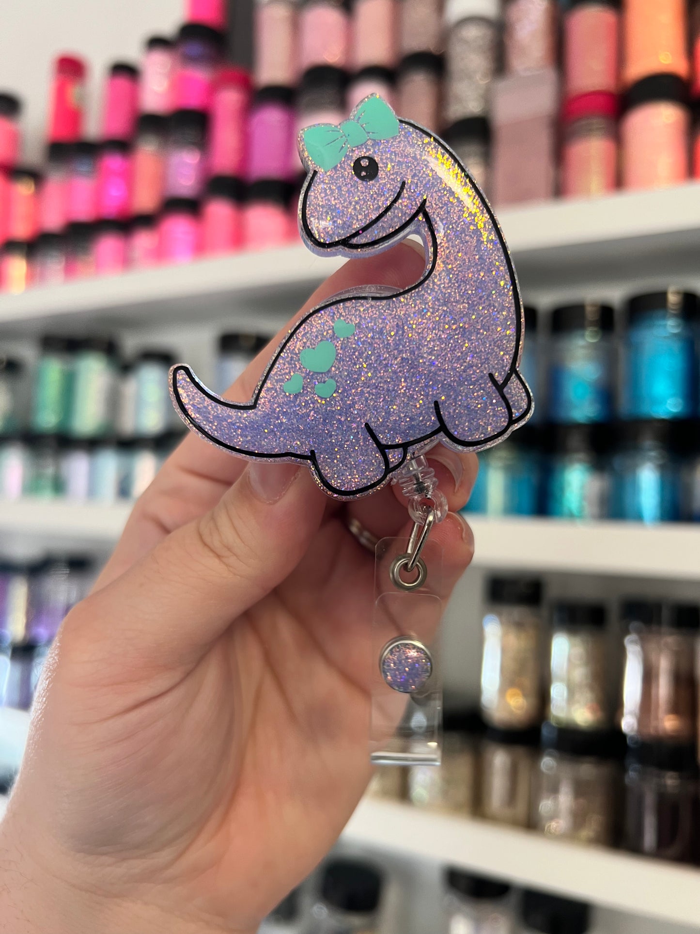 Dino with Bow Badge Reel