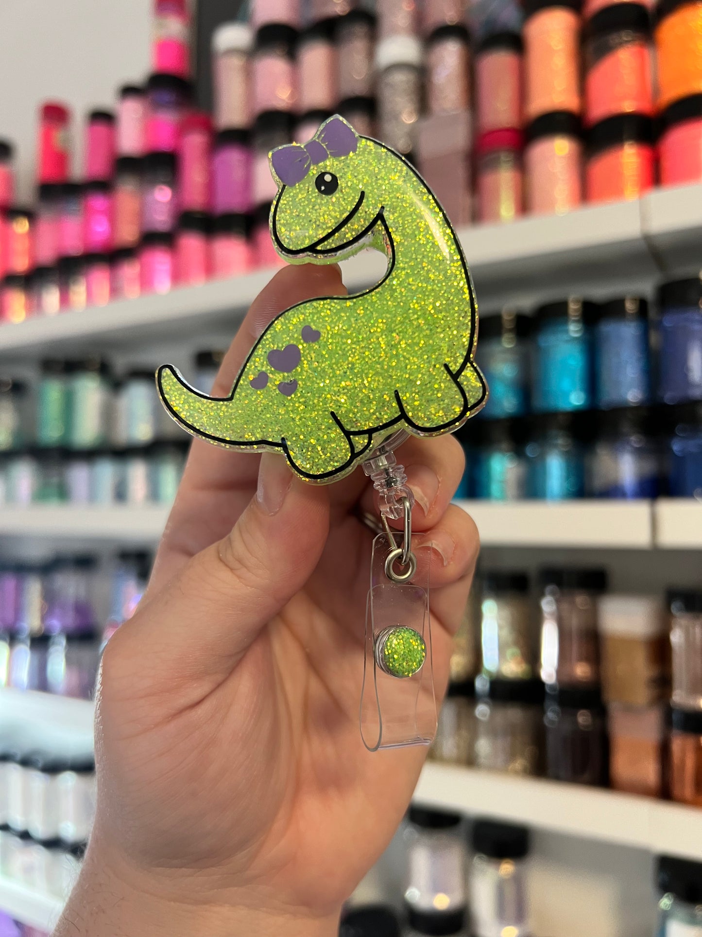 Dino with Bow Badge Reel