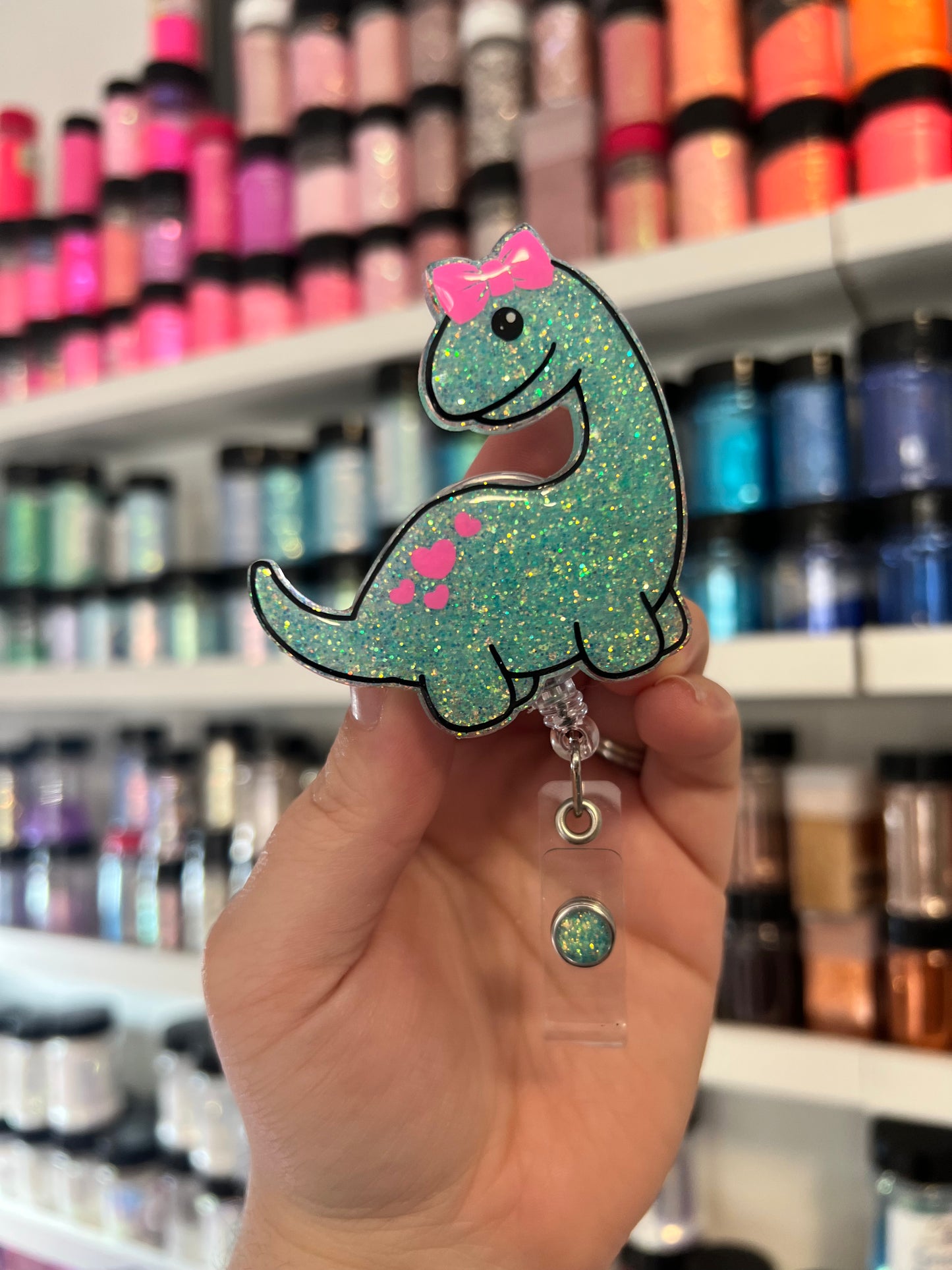 Dino with Bow Badge Reel