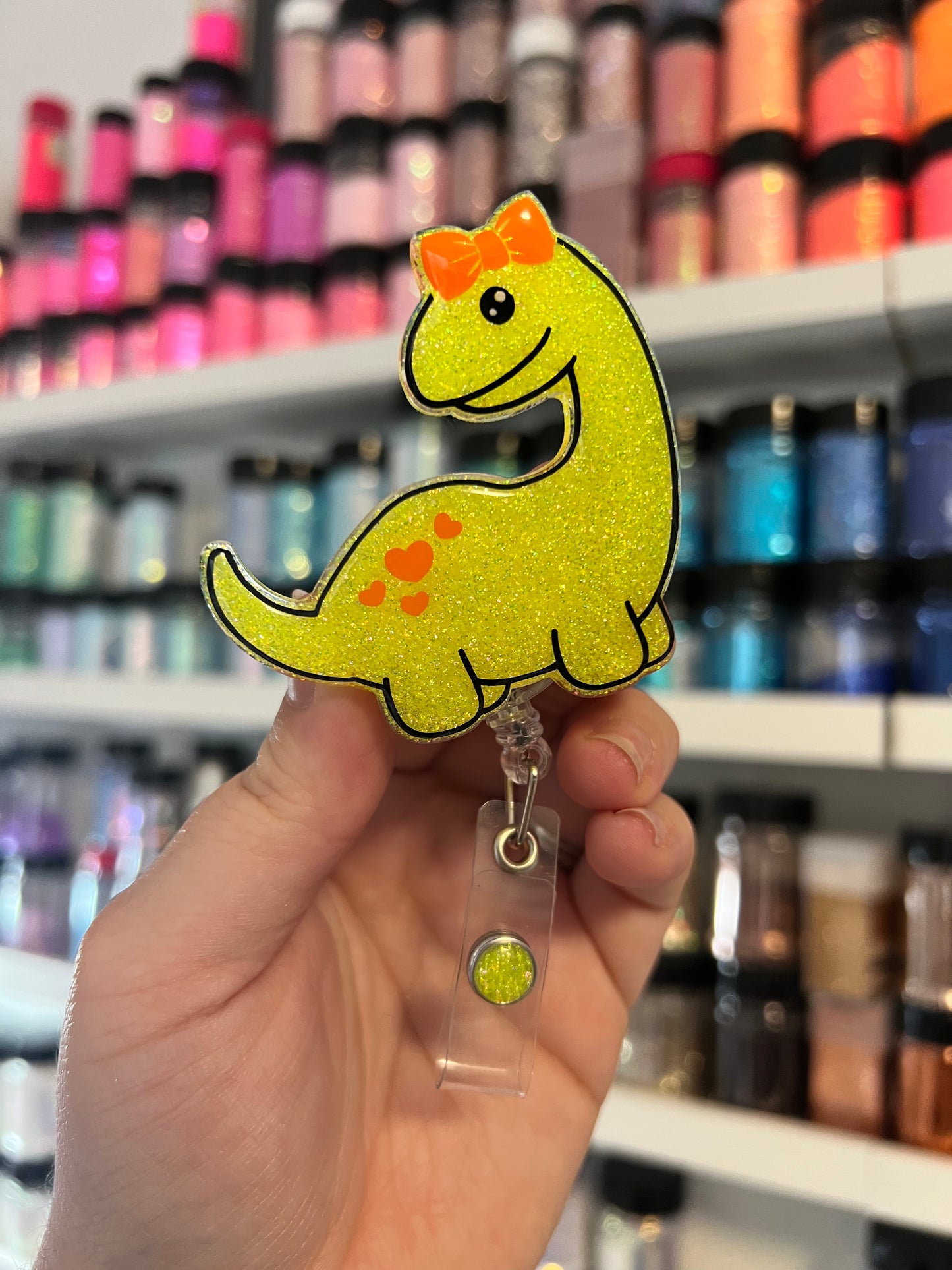 Dino with Bow Badge Reel